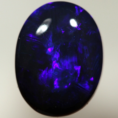 SOLID BLACK OPAL Royal blue rolling flashes. SEE VIDEO